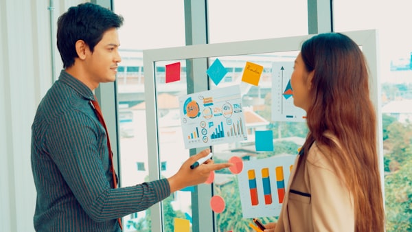 Asian professionals organising digital records and documents